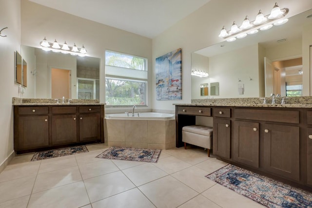 bathroom featuring vanity, separate shower and tub, and tile patterned floors