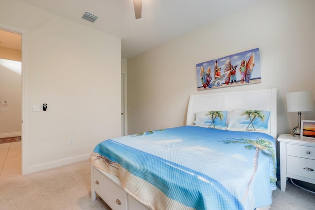 bedroom featuring light colored carpet and ceiling fan