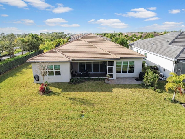 back of house with a yard