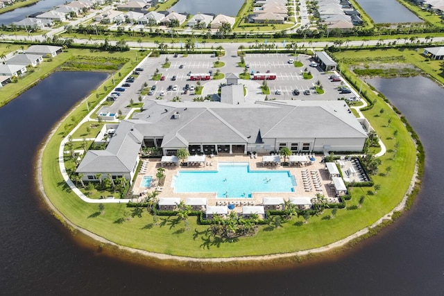 birds eye view of property with a water view