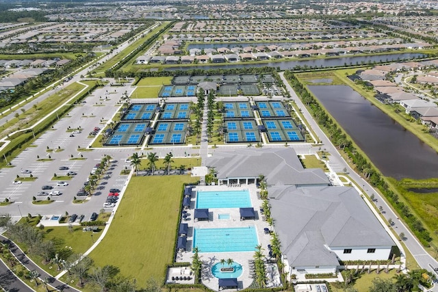 birds eye view of property featuring a water view