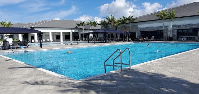 view of pool featuring a gazebo and a patio area