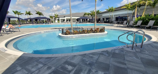 view of pool featuring a gazebo and a patio