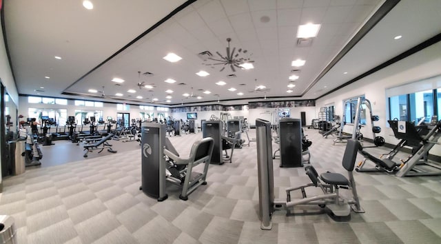 gym featuring light colored carpet and ceiling fan