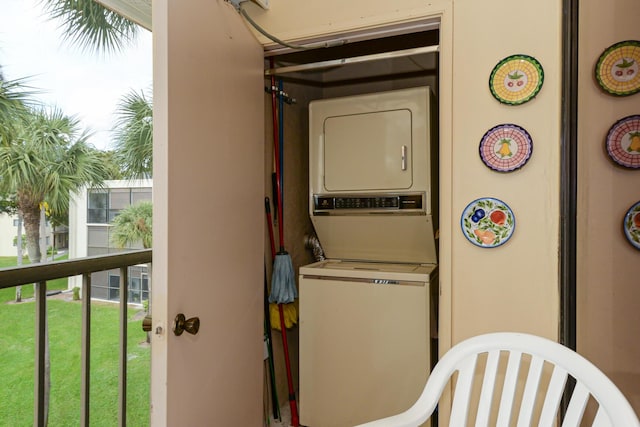 washroom with stacked washer / dryer