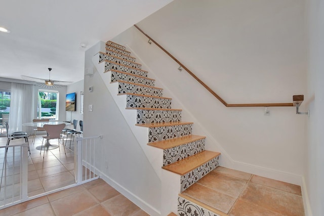 stairway featuring tile patterned flooring