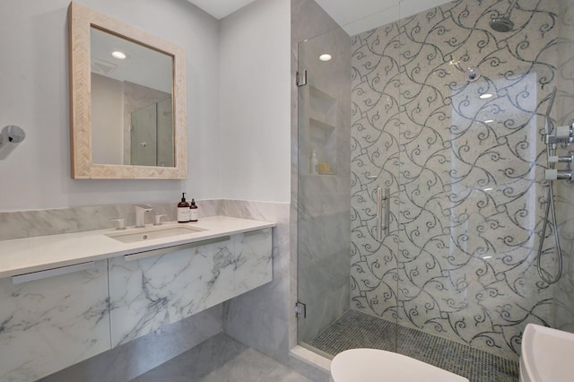 bathroom with vanity, a shower with shower door, and toilet