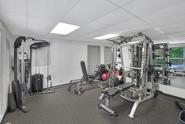 exercise room with a paneled ceiling