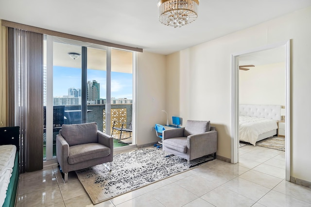 interior space featuring light tile patterned flooring, floor to ceiling windows, and an inviting chandelier