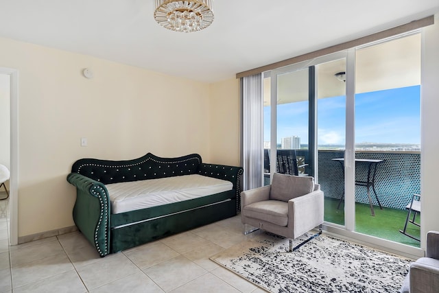 tiled bedroom with access to exterior and multiple windows