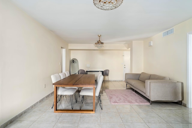 dining space with light tile patterned floors