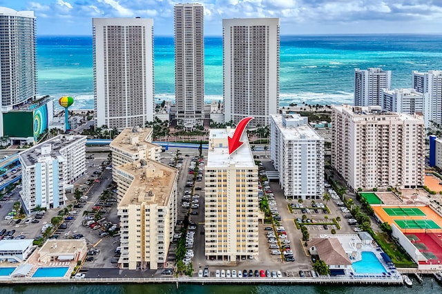 birds eye view of property with a water view