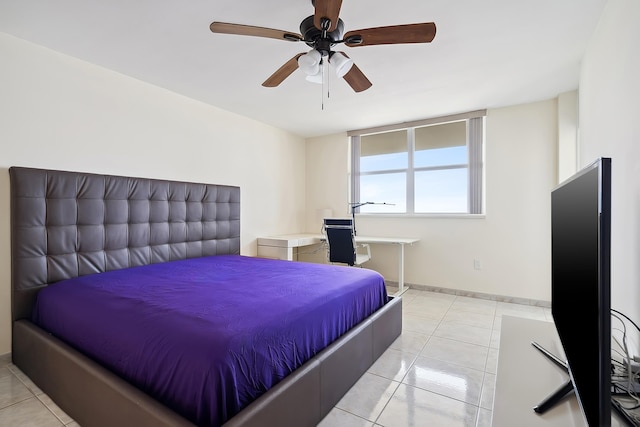 tiled bedroom with ceiling fan