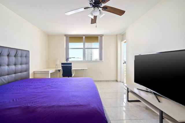 bedroom with ceiling fan and light tile patterned floors