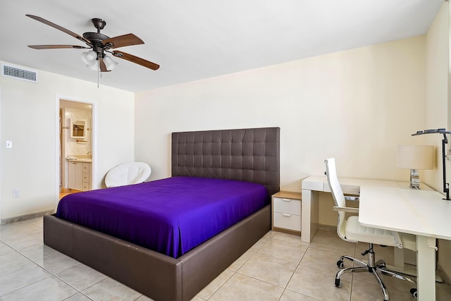 bedroom with light tile patterned floors, connected bathroom, and ceiling fan