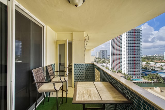 balcony featuring a water view