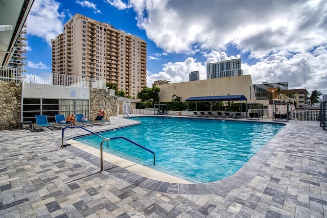 view of swimming pool with a patio