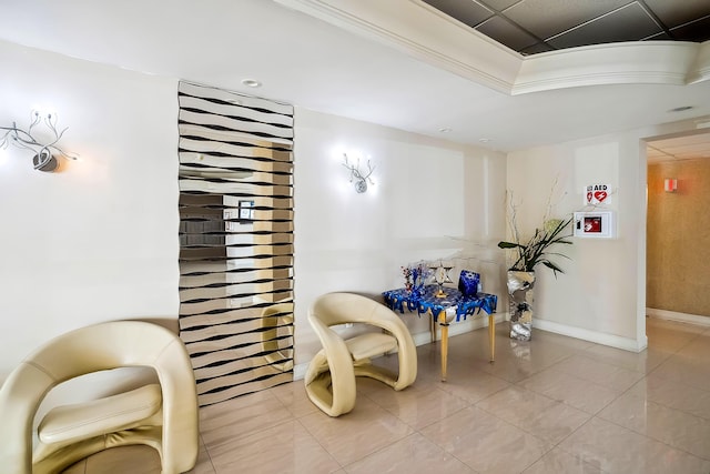 living area featuring tile patterned floors and ornamental molding