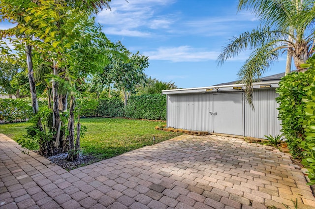 view of patio / terrace featuring a storage unit