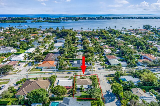 birds eye view of property with a water view