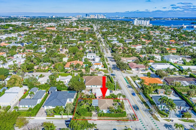 birds eye view of property featuring a water view