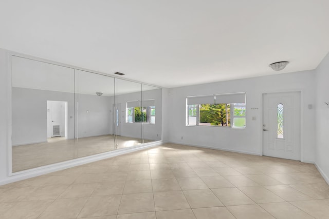 entryway with light tile patterned floors