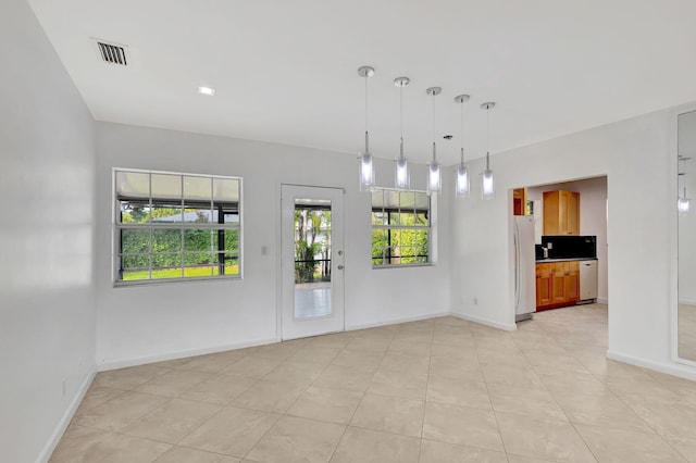 empty room with light tile patterned floors