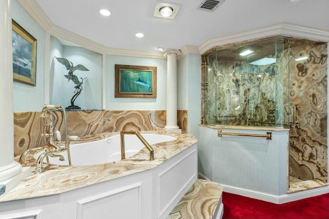 bathroom featuring ornate columns, crown molding, vanity, and a shower with shower door