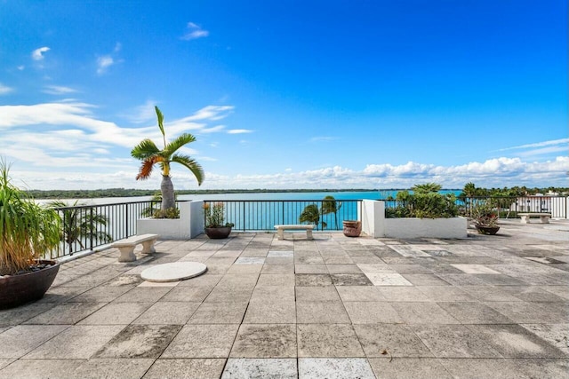 view of patio featuring a water view