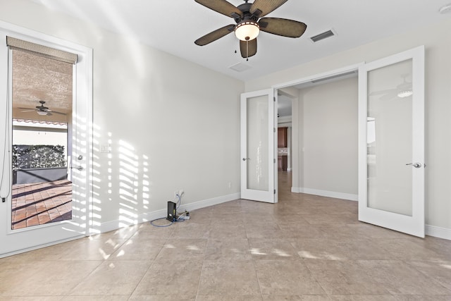 unfurnished bedroom featuring french doors and ceiling fan