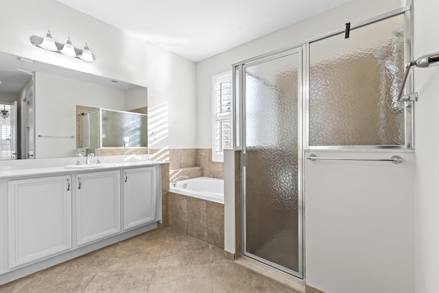 bathroom with vanity, tile patterned flooring, and independent shower and bath