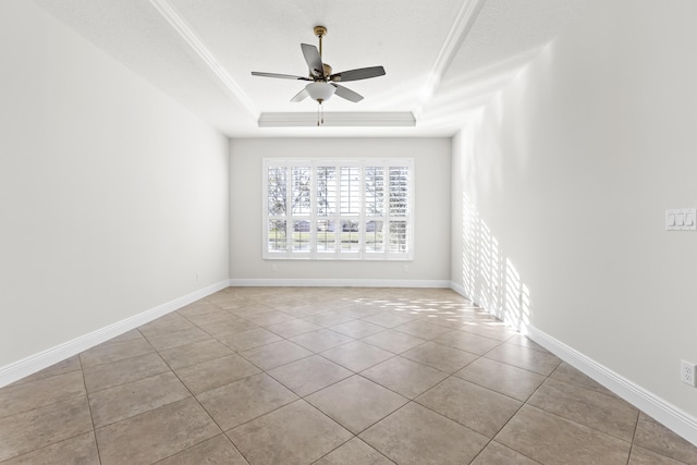 spare room with light tile patterned floors, ceiling fan, a raised ceiling, crown molding, and a textured ceiling