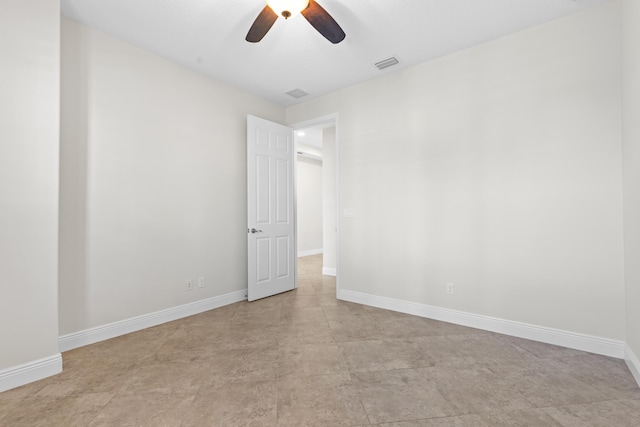 spare room with ceiling fan