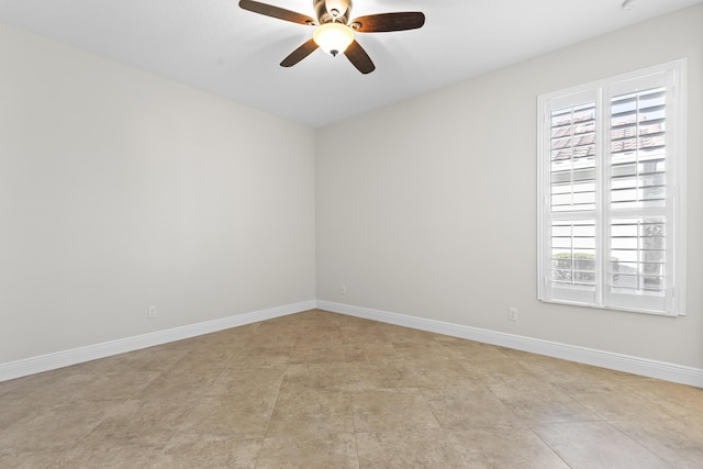 spare room with ceiling fan