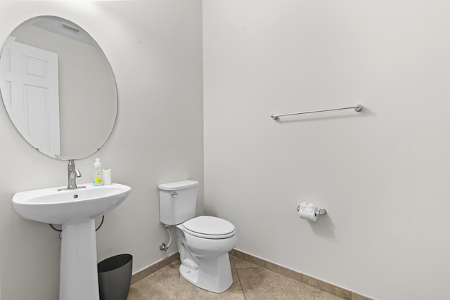 bathroom with tile patterned floors and toilet