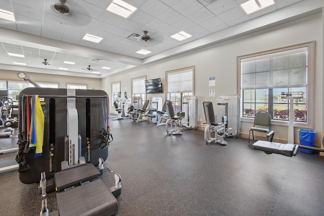 exercise room with a paneled ceiling