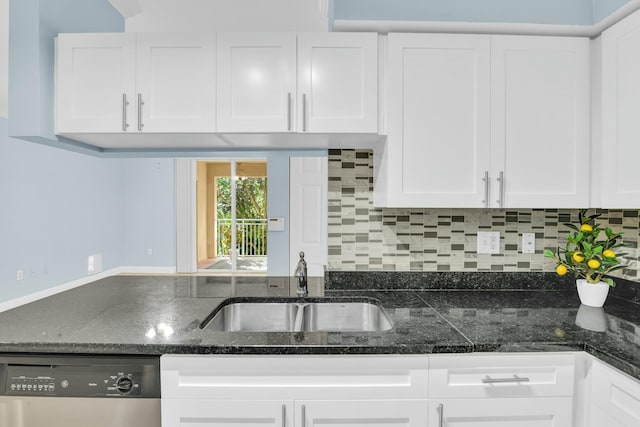 kitchen with white cabinetry, dishwasher, backsplash, and sink