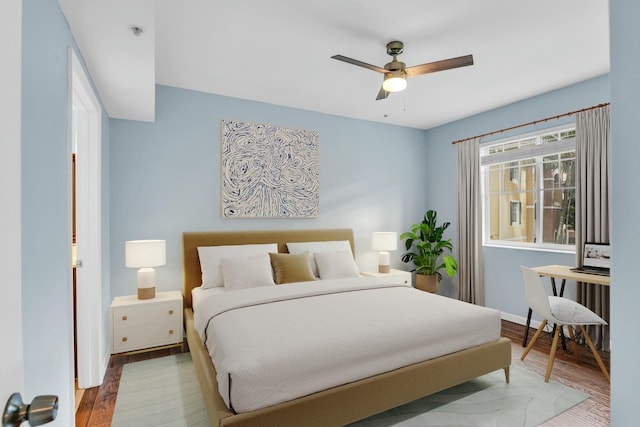 bedroom featuring ceiling fan and hardwood / wood-style floors