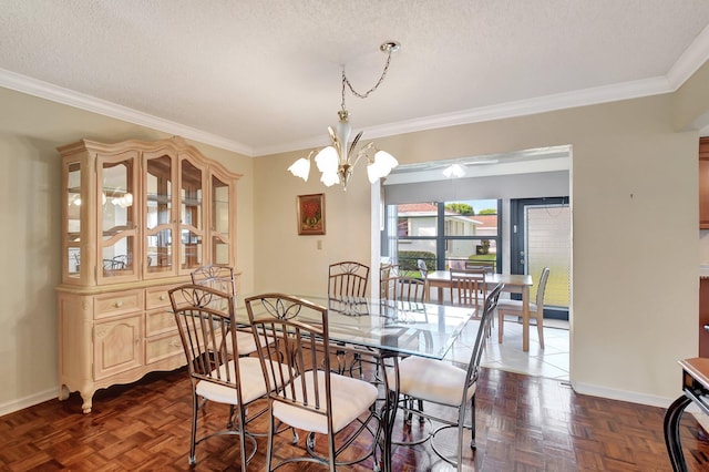 dining area featuring an inviting chandelier, crown molding, dark parquet floors, and a textured ceiling