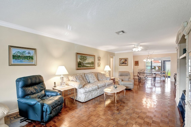 living room featuring crown molding, parquet flooring, and a textured ceiling