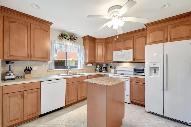 kitchen featuring sink, white appliances, a center island, and light tile patterned flooring