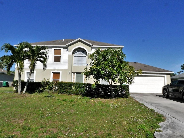 view of front of house featuring a front lawn and a garage