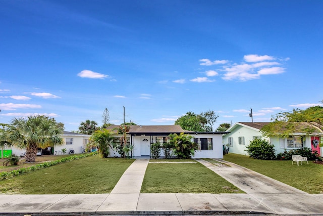 single story home with a front yard