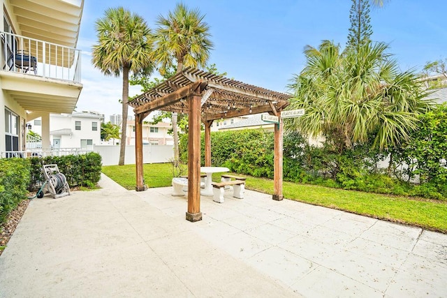 view of patio featuring a balcony and a pergola