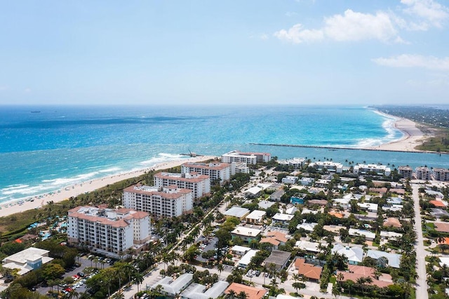 aerial view with a water view and a view of the beach