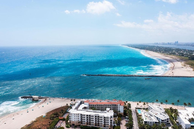 bird's eye view featuring a view of the beach and a water view