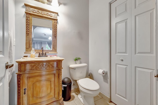 bathroom with tile patterned floors, vanity, and toilet