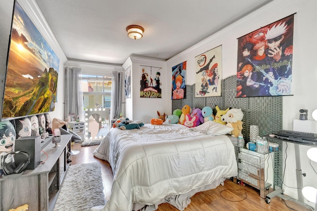 bedroom featuring crown molding and hardwood / wood-style flooring