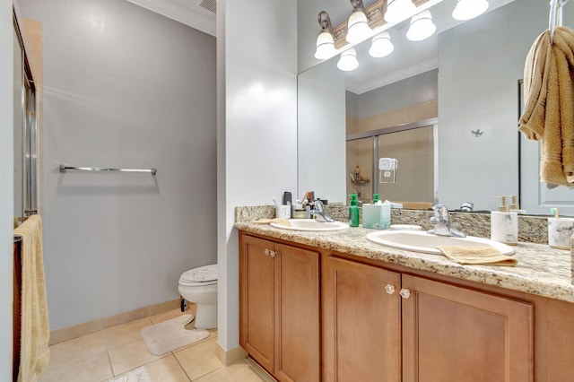 bathroom with toilet, a shower with shower door, ornamental molding, vanity, and tile patterned flooring