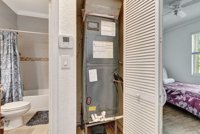 utility room with heating unit